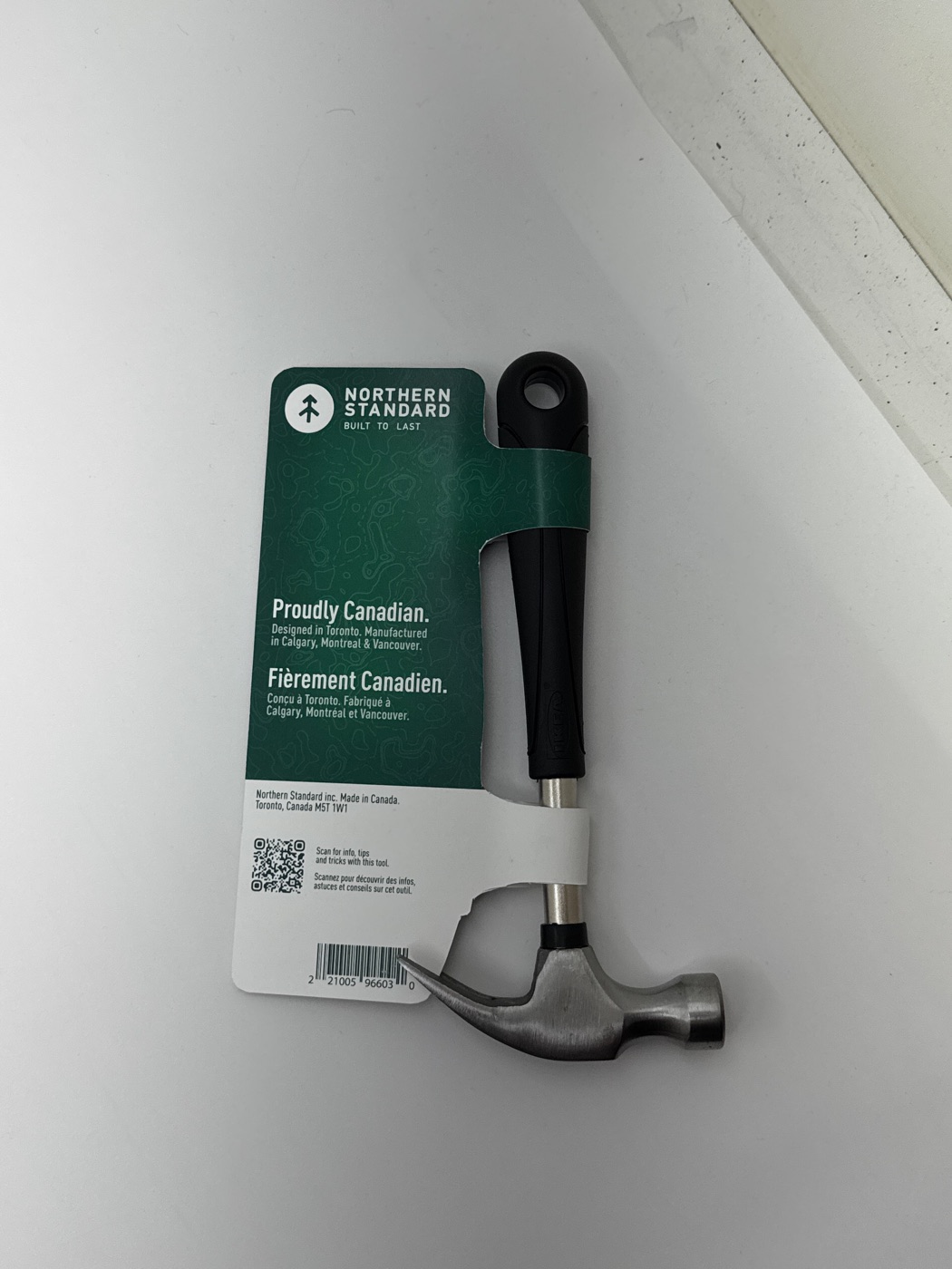 Back of the finished Northern Standard hammer prototype showing the reverse green package panel and supporting bilingual copy